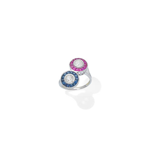 A ruby, sapphire and diamond crossover ring