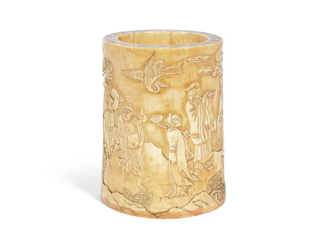 A carved ivory 'Eight Immortals' brushpot 17th/18th century