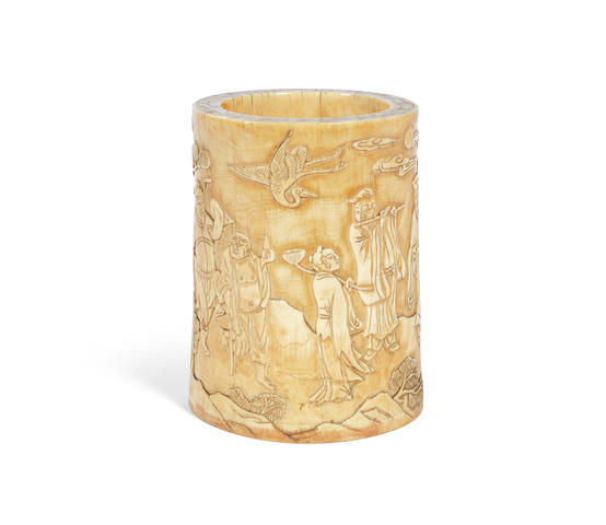 A carved ivory 'Eight Immortals' brushpot