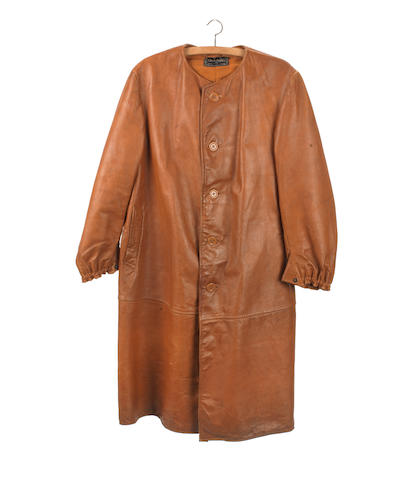 Bonhams : A tan leather motorist's overcoat by Dunhills Ltd,