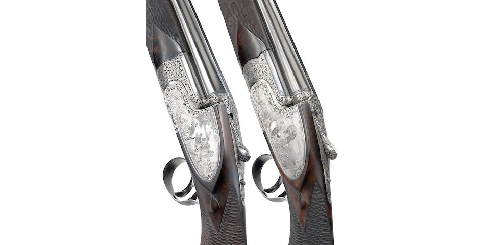 A fine pair of 12-bore single-trigger over-and-under sidelock ejector guns by Desenzani, no. 0217/0218 In their leather case with canvas cover
