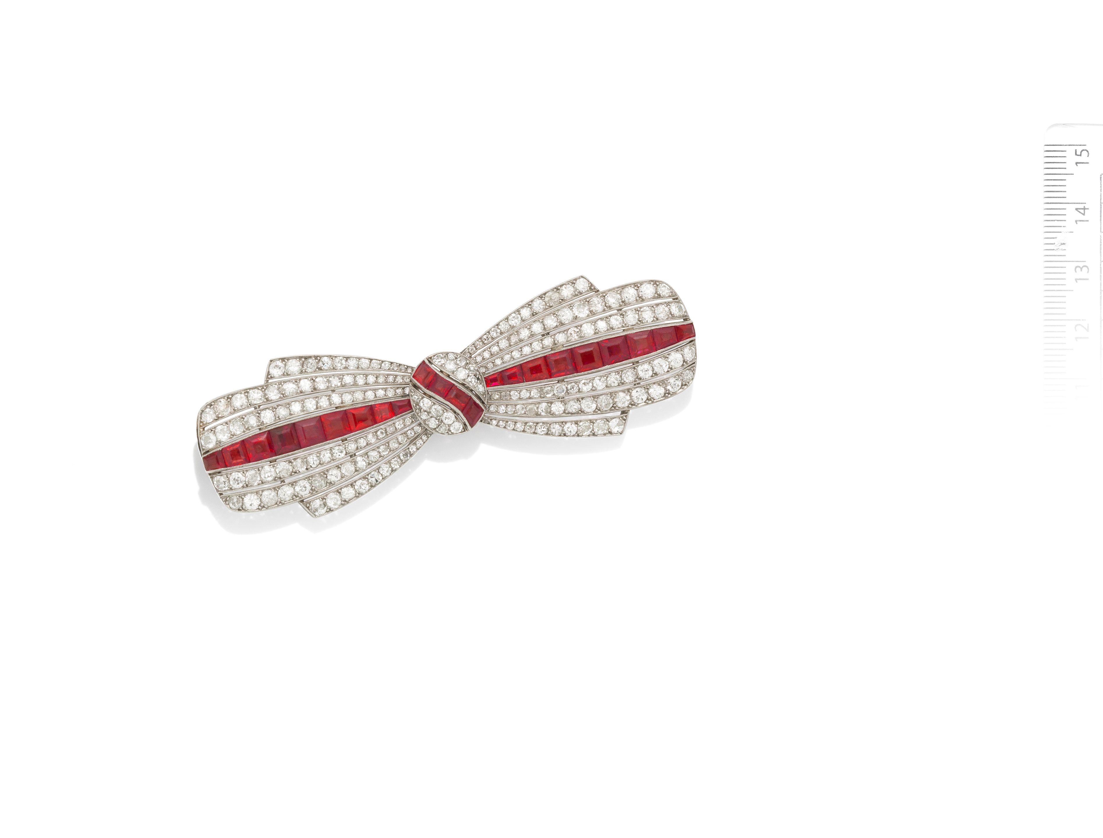 A ruby and diamond bow brooch,