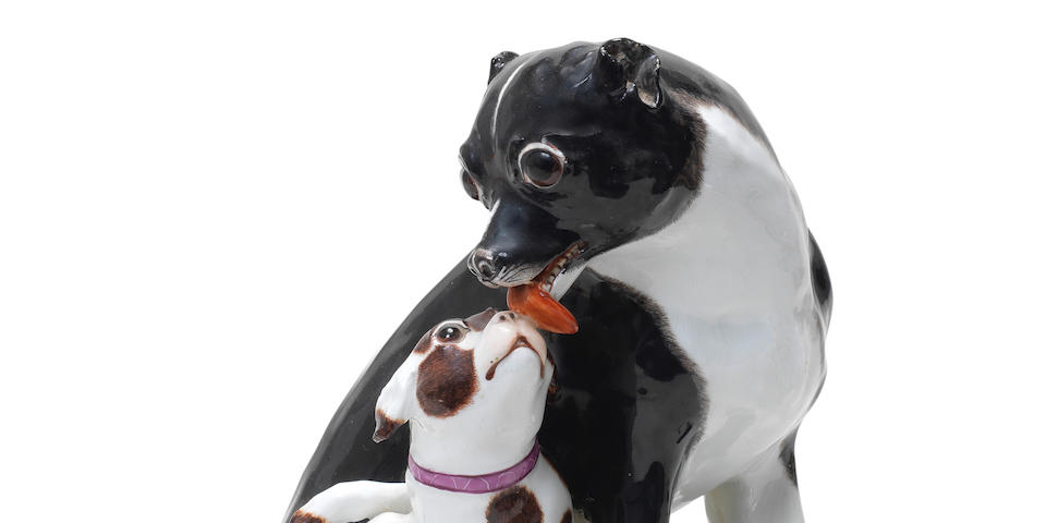 A Meissen group of a Danish pug dog and two puppies, circa 1745