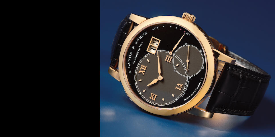 A. Lange & S&#246;hne. An 18K rose gold manual wind calendar wristwatch with power reserve  Lange 1, Circa 2003