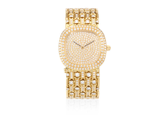 A custom made heavy 18K gold and diamond set automatic bracelet watch Circa 1980