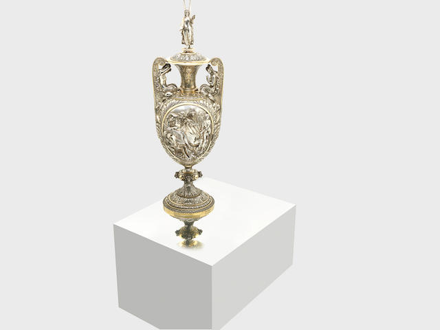 An impressive Victorian parcel-gilt silver cup and cover by Hancocks & Co, London 1872