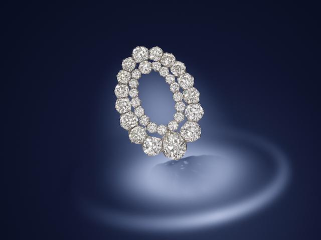 A diamond clip brooch, by Hennell,