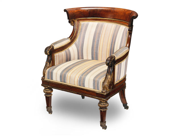 A George IV rosewood, mahogany and parcel gilt library bergere in the manner of Morel and Hughes