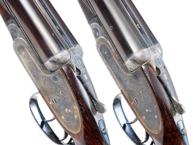 A PAIR OF KELL-ENGRAVED 12-BORE SELF-OPENING SIDELOCK EJECTOR GUNS BY J. PURDEY & SONS, NO. 24318/9 With their brass-mounted oak and leather case with canvas cover