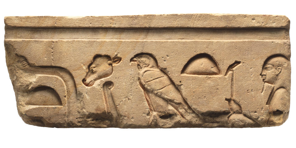 An Egyptian sandstone relief with hieroglyphs