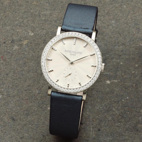 Patek Philippe. An 18K white gold and diamond set manual wind wristwatch Calatrava, Ref: 7120, Sold 26th August 2012