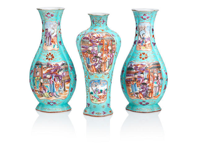 A garniture of three Mandarin pattern baluster vases 18th century