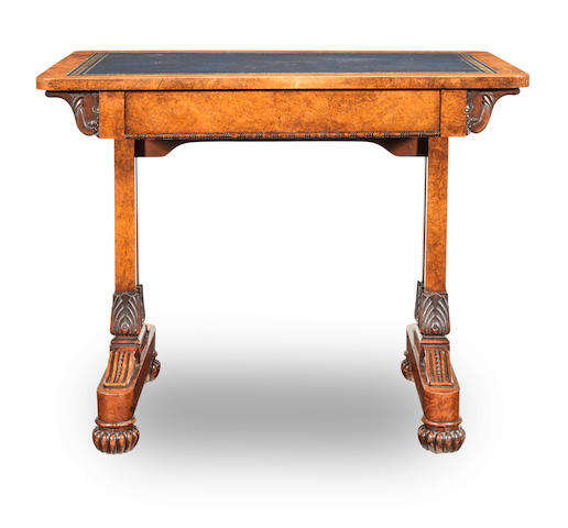A William IV carved amboyna writing table in the manner of T. and G. Seddon
