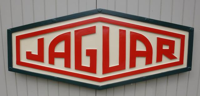A 'Jaguar' garage display emblem,