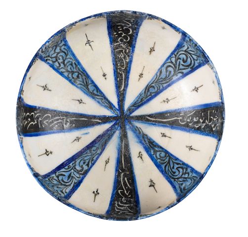 A Kashan underglaze-painted pottery bowl Persia, 12th/ 13th Century