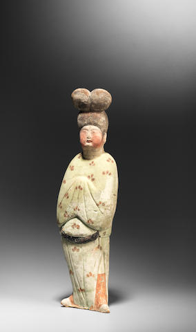 A painted pottery figure of a court lady Tang Dynasty