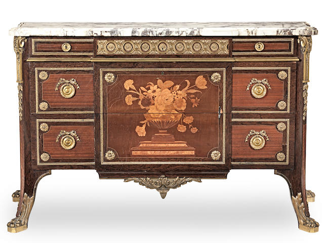 A French 19th century gilt bronze mounted bois satine, amaranth, sycamore and marquetry commode originally retailed by Bertram & Son., after the celebrated Louis XVI model by Jean-Henri Riesener