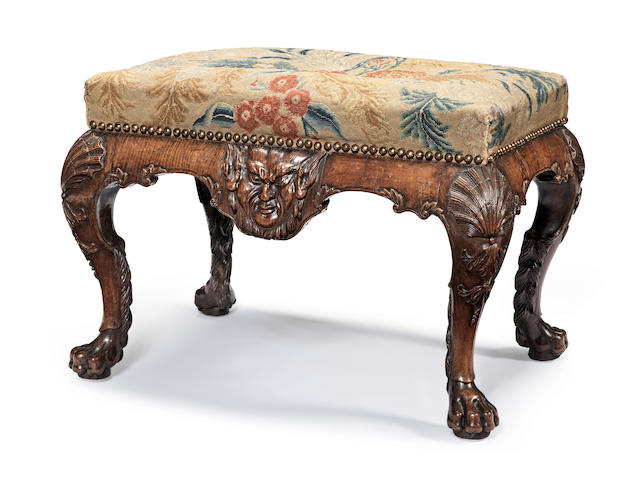 A George II carved walnut stool circa 1730, probably after a design by William Kent