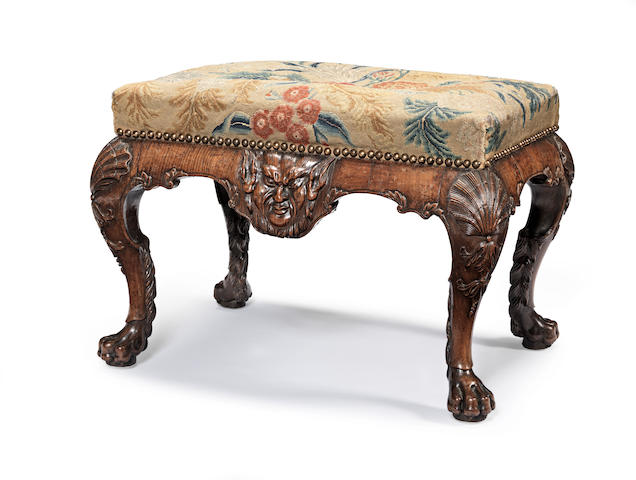 A George II carved walnut stool circa 1730, probably after a design by William Kent