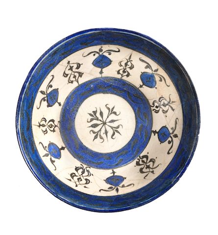 A Kashan underglaze-painted pottery bowl Persia, 12th/ 13th Century