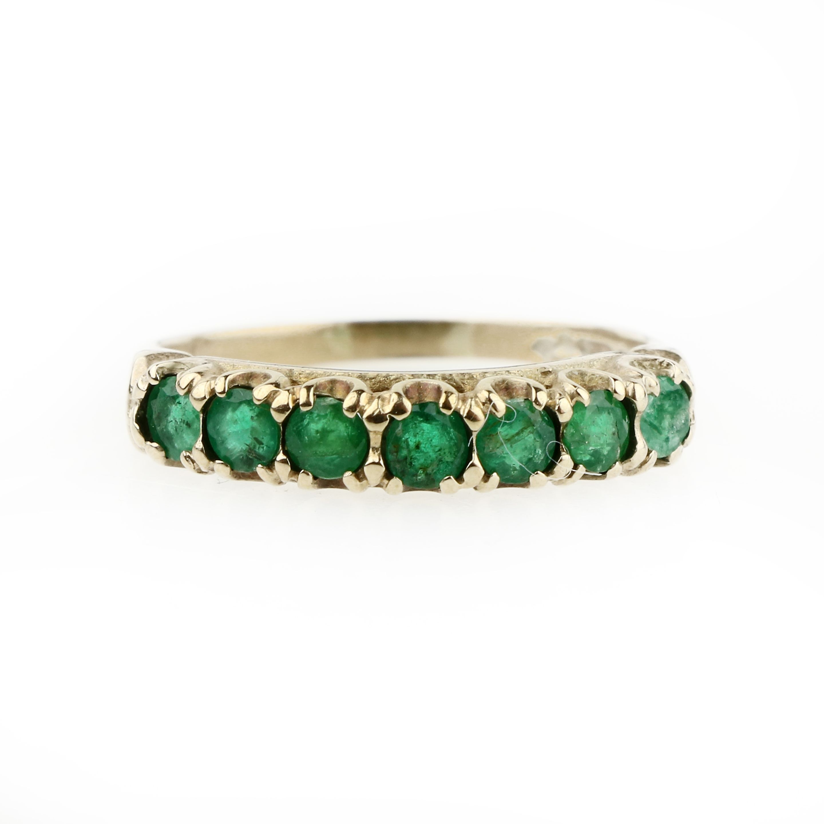 An emerald half-eternity ring