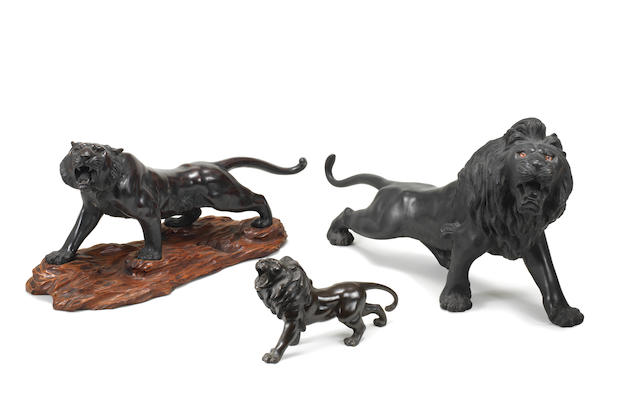 Three bronze animals One lion by Kiyomitsu and the tiger by Watanabe, Meiji era (1868-1912), late 19th/early 20th century (4)
