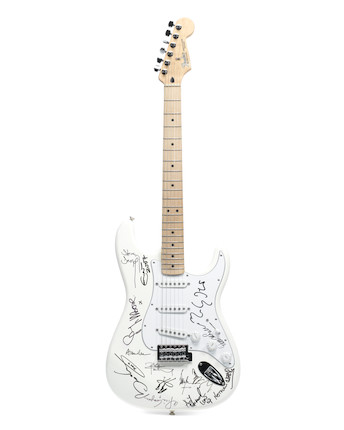 A multi-signed Fender Stratocaster guitar sold on behalf of the Rainbow Children's Hospice, signatures obtained 2007-2018, image 1