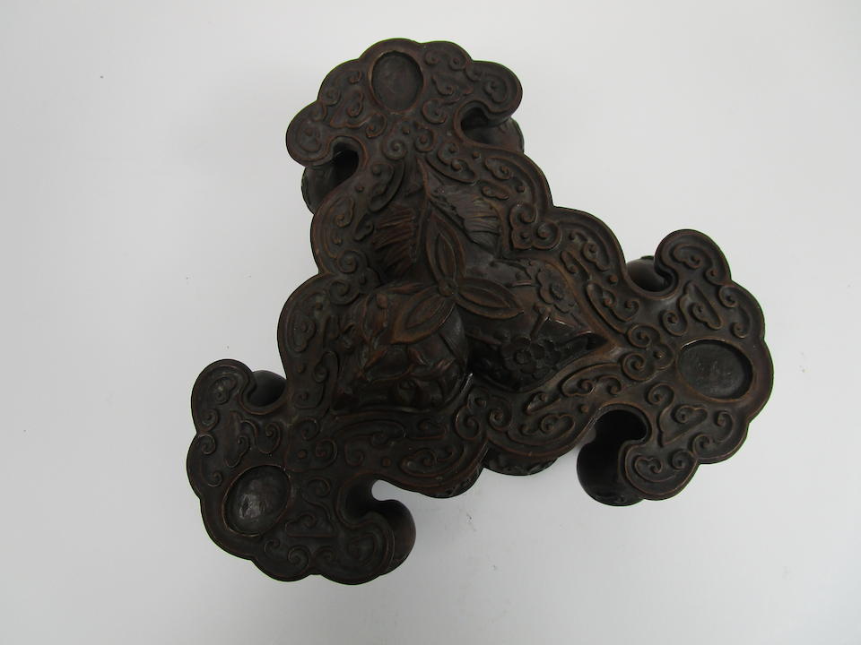 A large and impressive bronze tripod incense burner on wood stand Well defined Xuande six-character mark but 19th century (2)