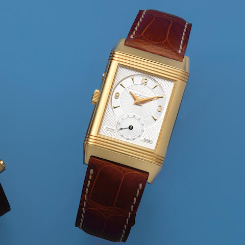 Jaeger-LeCoultre. An 18K gold manual wind reversible rectangular wristwatch  Reverso Night & Day, Ref: 270.1.54, Sold 1st September 1998