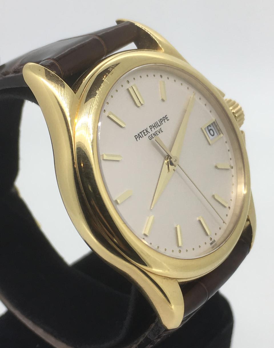 Patek Philippe. An 18K gold automatic calendar wristwatch  Calatrava, Ref: 5227, Sold 08th May 2006
