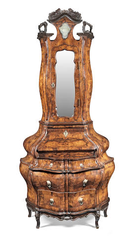 An Italian 18th century carved and figured walnut serpentine bureau cabinet of exaggerated bombe form Venetian