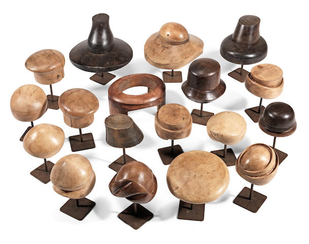 An interesting collection of seventeen early to mid 20th century polished wood hat blocks (18)
