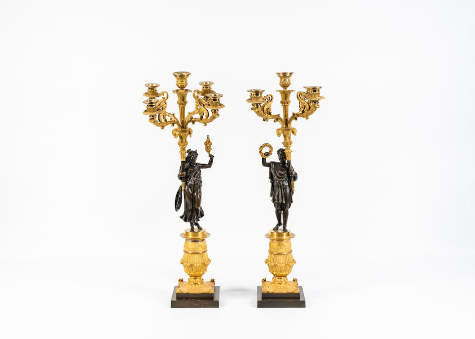 A pair of Restoration patinated and gilt-bronze candelabras (2)