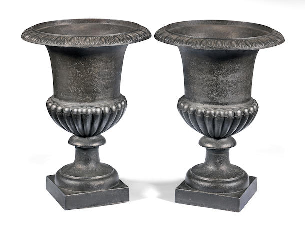A pair of cast iron campana urns   (2)