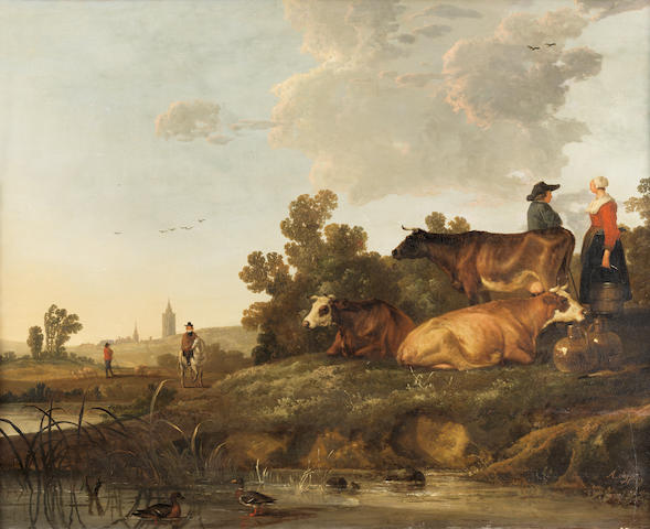 Circle of Aelbert Cuyp (Dordrecht 1620-1691) A drover and milkmaid standing beside cattle, a view to a town in the distance