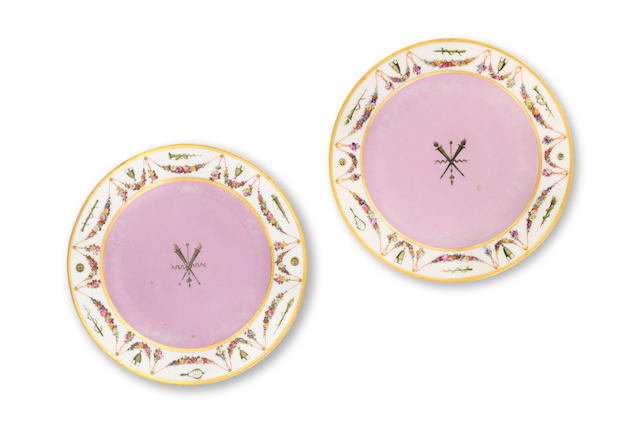 A pair of S&#232;vres dinner plates from the 'Service fond rose guirlande de fleurs et attributs' made for Napoleon I, circa 1805