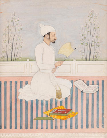 A court secretary, wearing a white jama, seated on a terrace, writing instruments and a manuscript before him Jammu, by an artist of the second generation after Nainsukh, early 19th Century