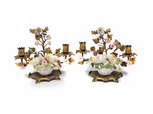 A pair of gilt metal and porcelain candelabra with Meissen models of birds Mid 18th Century