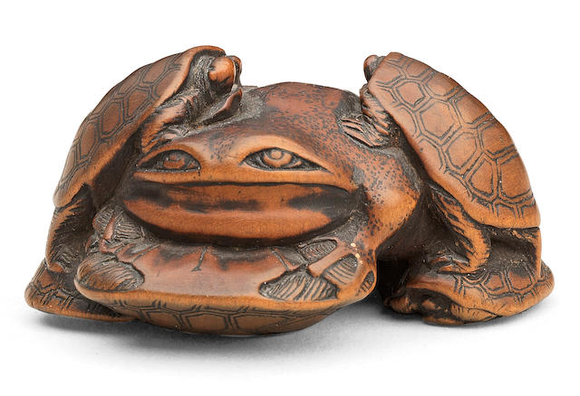 A wood netsuke of terrapins and a frog By Hidetsugu, Edo period (1615-1868), 19th century