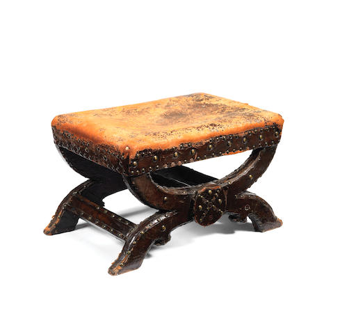 A rare hide-upholstered beech X-frame stool, possibly English,  circa 1620