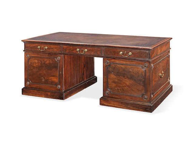 A George II mahogany partner's desk In the manner of Thomas Chippendale