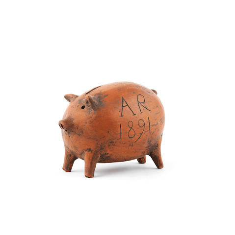A terracotta piggy bank, dated '1891'