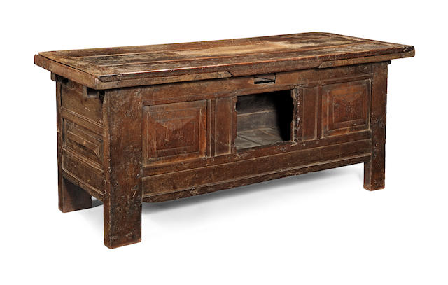 An exceptionally rare mid-16th century joined oak draw-leaf table-cupboard, English, circa 1540-60