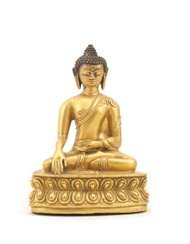 A gilt-bronze figure of Buddha Akshobhya Tibet,16th/17th century