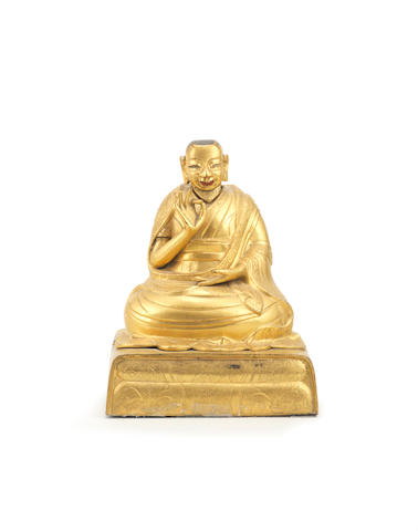 A gilt-bronze figure of a seated Lama Tibet, 18th century