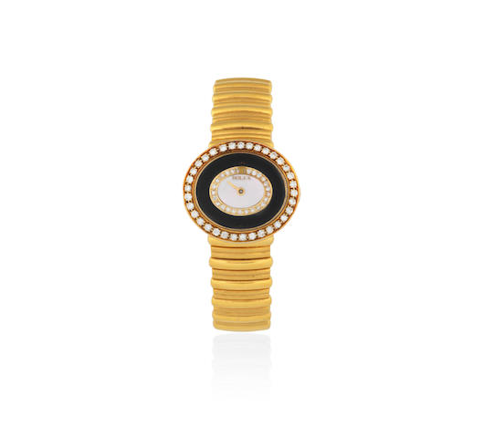 Rolex. A lady's 18K gold diamond set manual wind bracelet watch  Cellini, Ref: 4081, Circa 1986