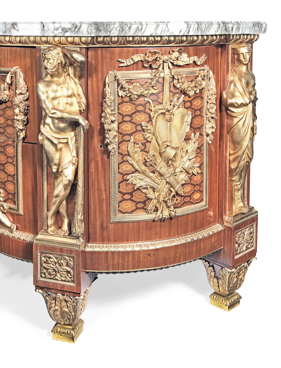 A fine French early 20th century mahogany, fruitwood marquetry and gilt bronze mounted commode in the Louis XVI style, after the original by Jean-Henri Reisener