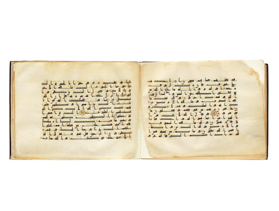 A bound group of ten leaves from six separate suras of a dispersed manuscript of the Qur'an, written in kufic script on vellum Near East or North Africa, 9th Century image 1