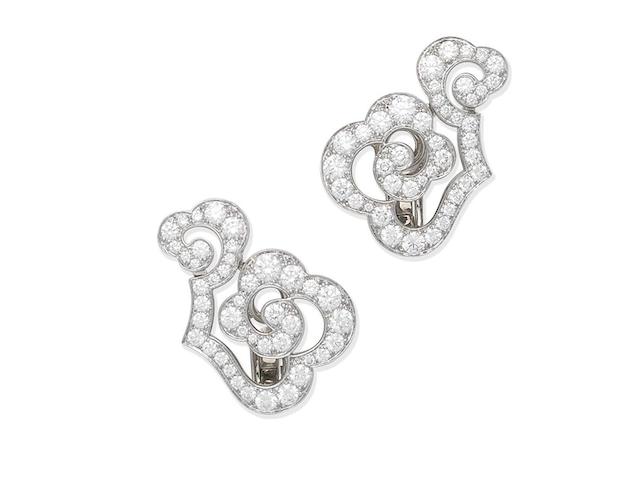 A pair of diamond earclips, by Cartier