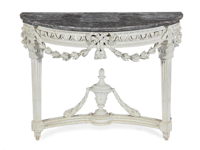 A French 19th century carved and painted console table In the Louis XVI style